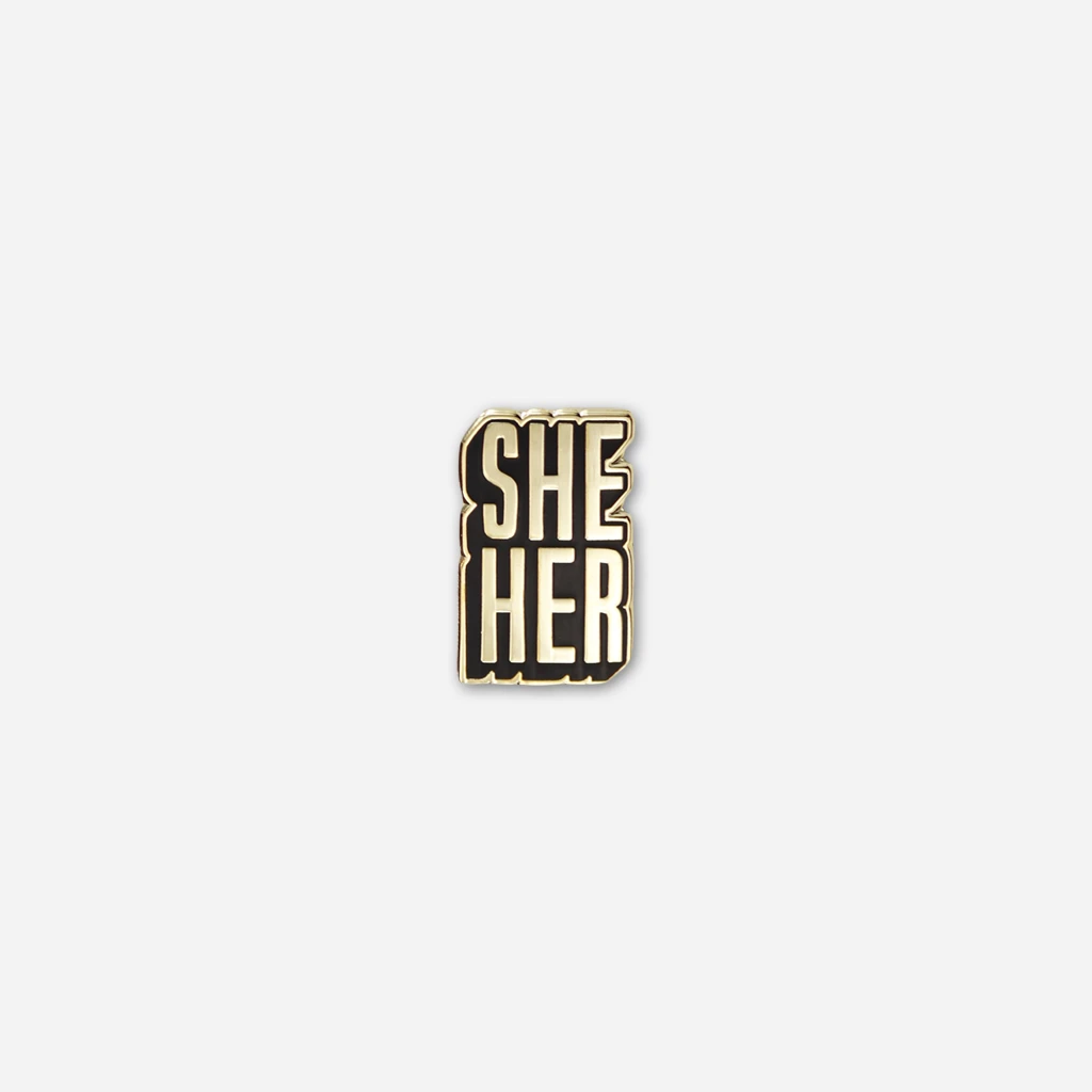 Autostraddle She/Her Pronoun Pin New Merch 1 Autostraddle She/Her Pronoun Pin New Merch