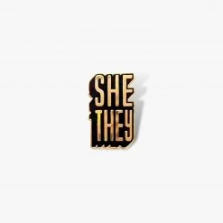 Autostraddle New Merch She/They Pronoun Pin